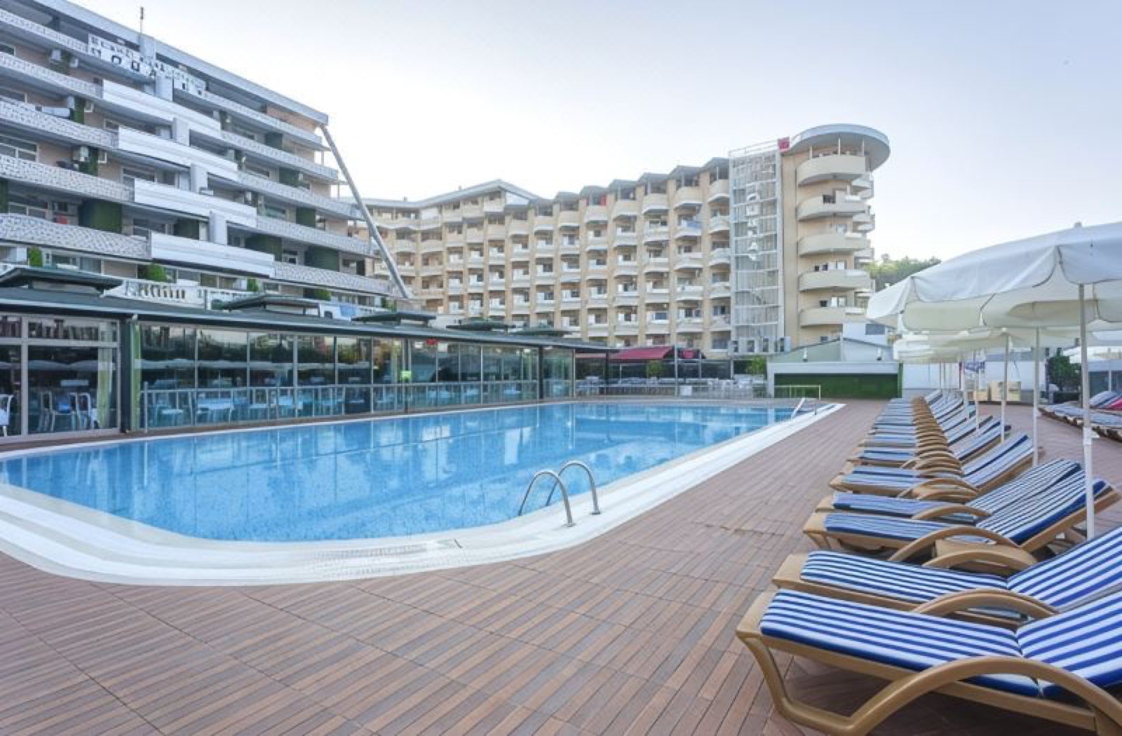 Loungers on the deck beside the pool